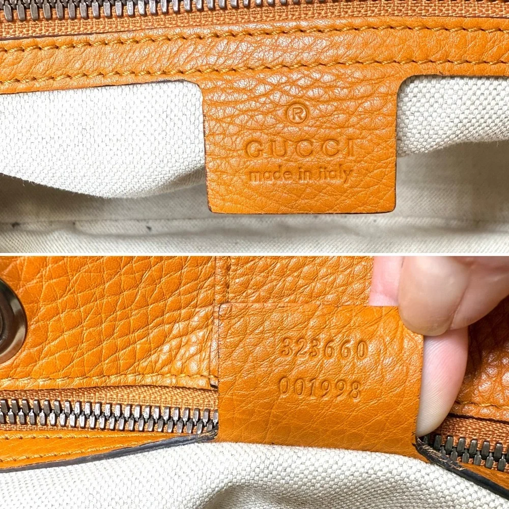 Gucci authentic satchel bag orange leather black bamboo handles with a strap